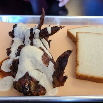 Saw's BBQ signature dishes  Pulled Pork Sandwich, Smoked Chicken with White Sauce, Ribs, Stuffed Taters, Banana Pudding.